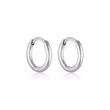 Silver Linda Tahija Classic Huggie Earrings featuring simple, sleek hoop design for everyday wear.