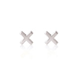 Sterling silver Linda Tahija cross stud earrings featuring small, polished cross designs perfect for everyday wear.