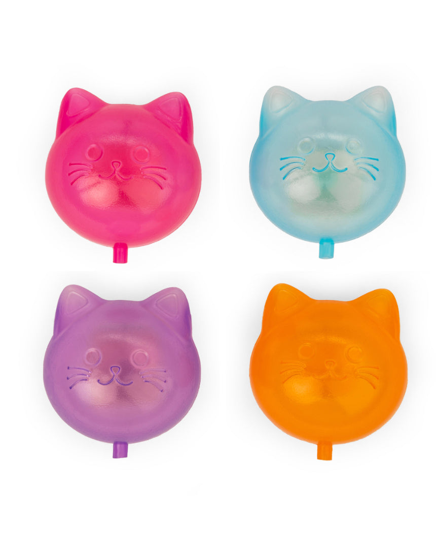 Set of 24 reusable cat ice cubes from isAlbi, displayed in a clear container with some ice cubes and a playful cat in the background.