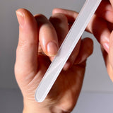 Hanami Nano Glass Nail File and Buffer showing a sleek, clear glass nail file with a textured surface for smoothing nails.