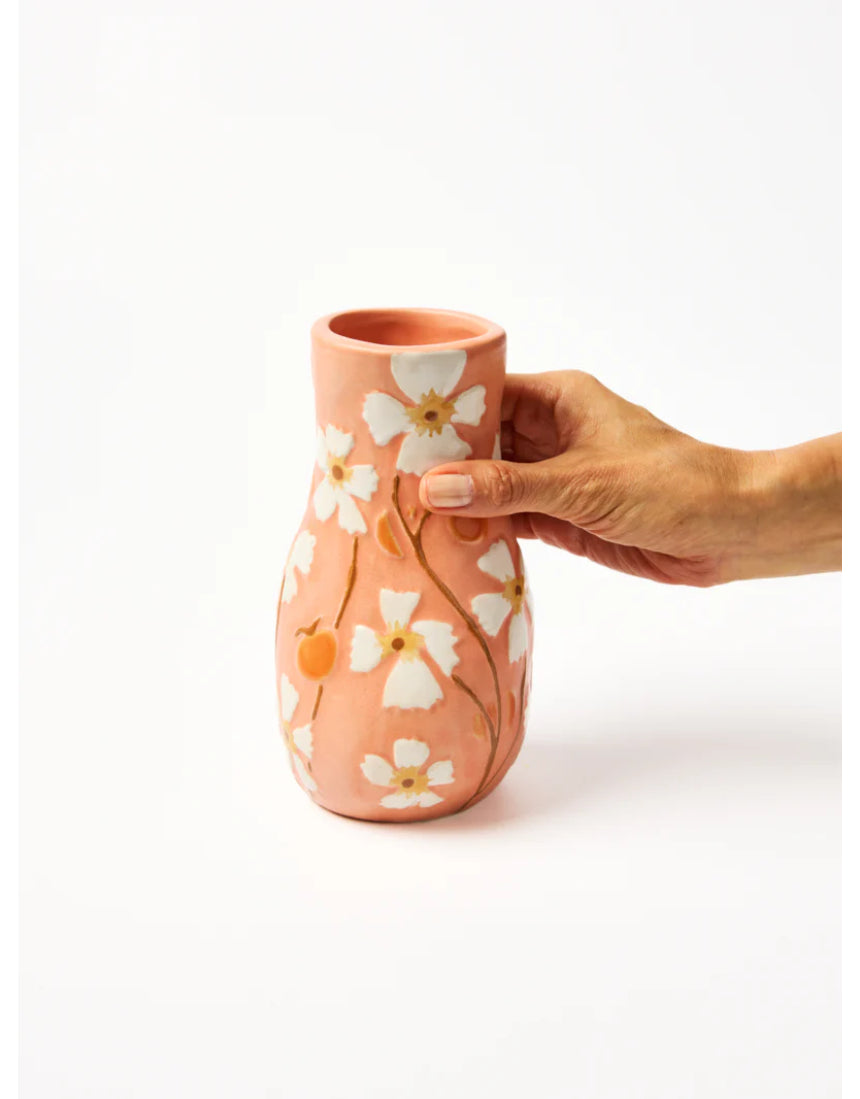 Jones & Co Juniper Vase in peach color, featuring a smooth ceramic surface and elegant shape, ideal for floral arrangements.
