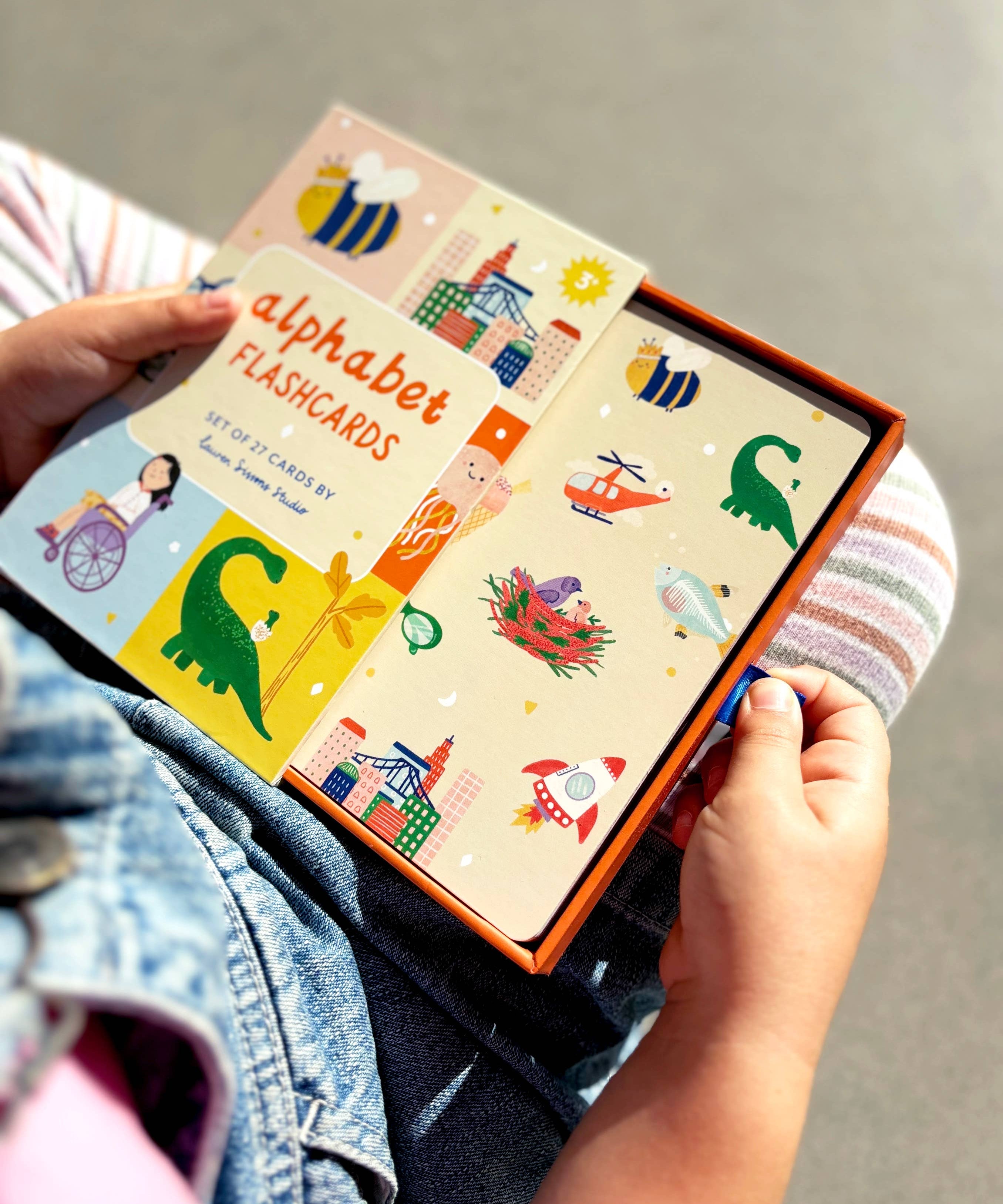Lauren Sissons Studio A-Z illustrated alphabet flashcards showing colorful letters and playful illustrations for early learning.