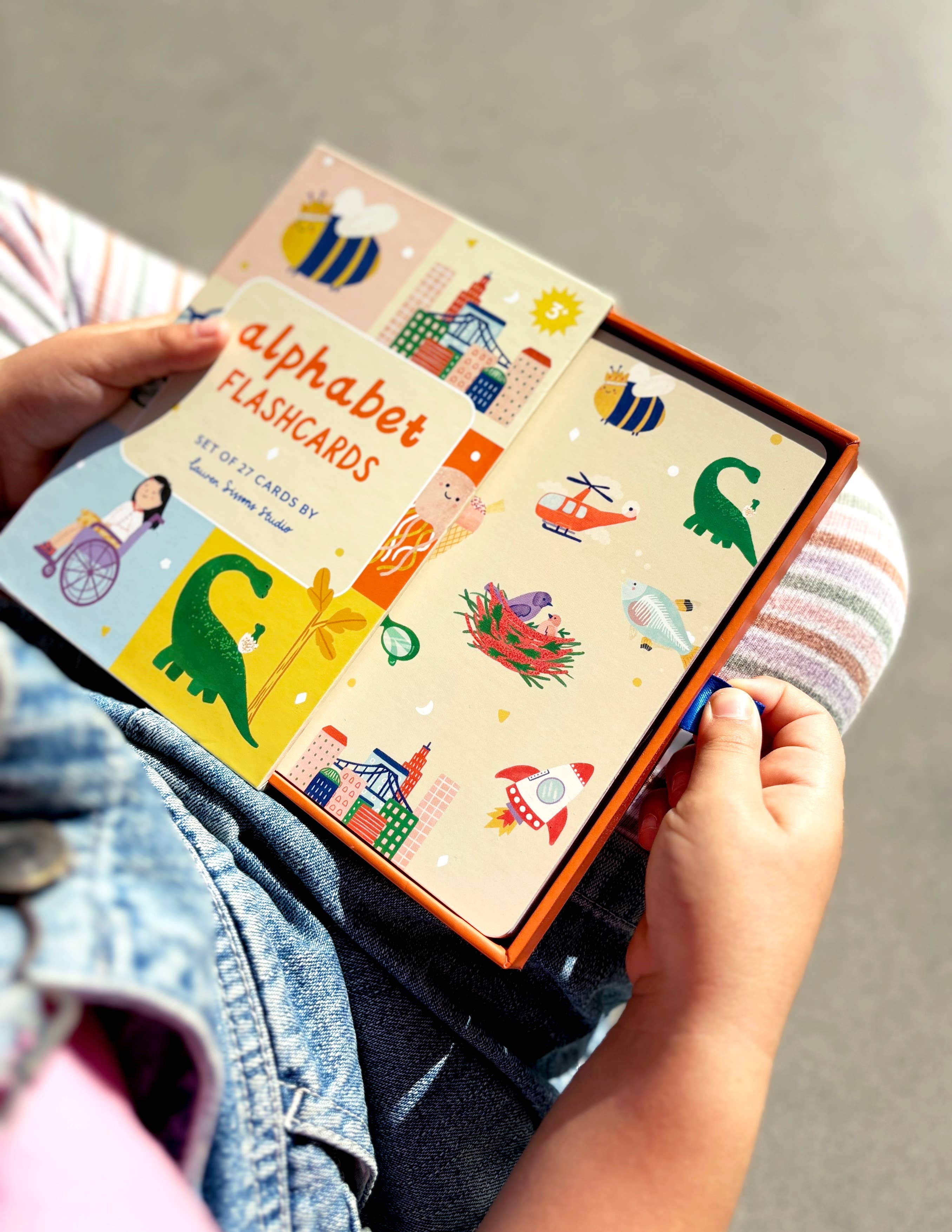 Lauren Sissons Studio A-Z illustrated alphabet flashcards showing colorful letters and playful illustrations for early learning.