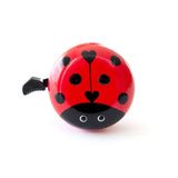 Beep Ladybug Bike & Scooter Bell in red, featuring a cute ladybug design, mounted on a bicycle handlebar.