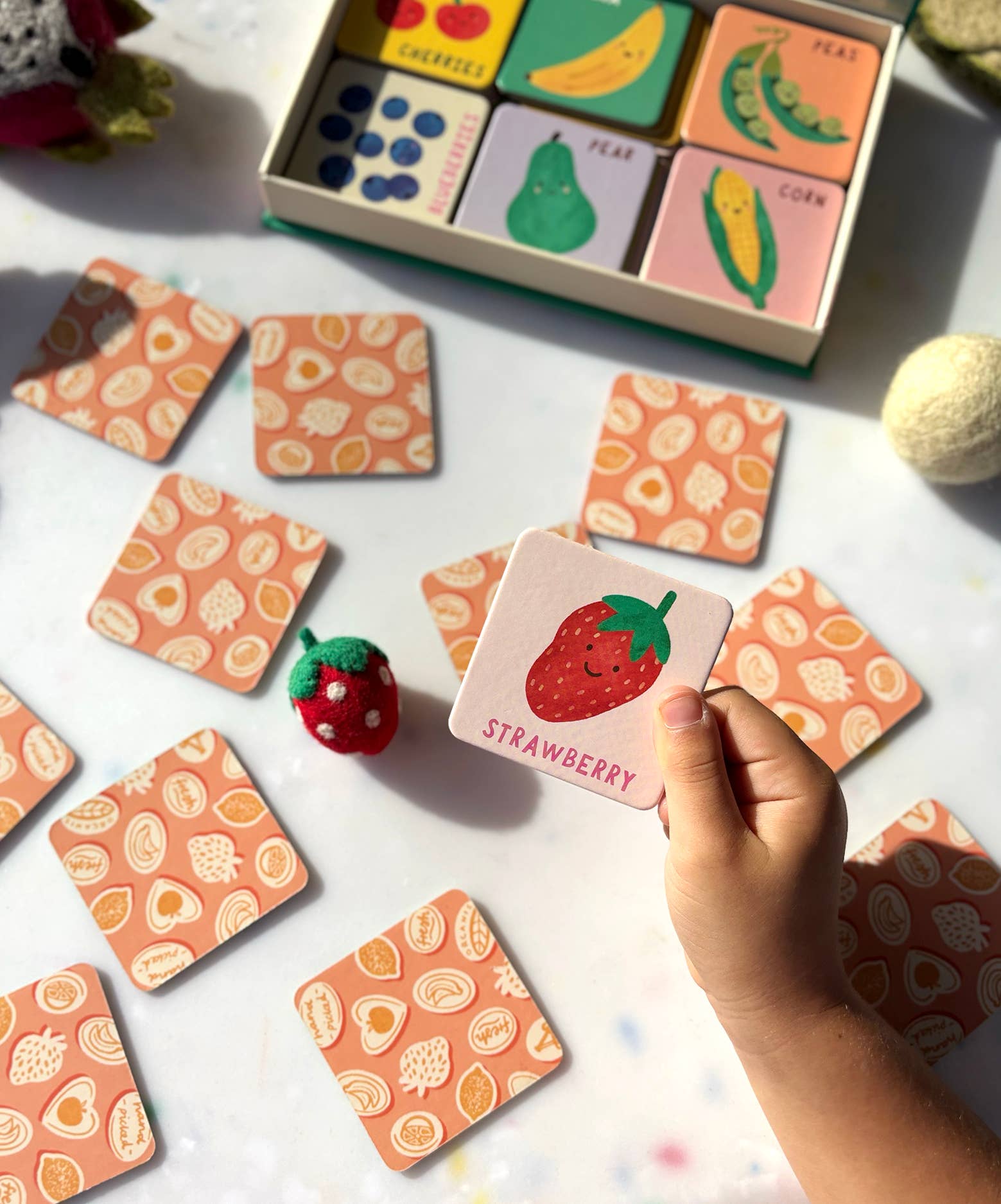 Lauren Sissons Studio fruit and vegetable memory and matching game with colorful cards featuring fresh produce images.