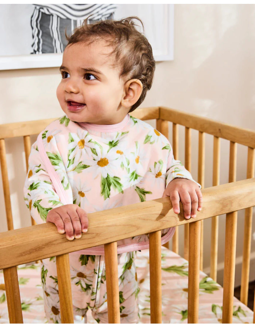 Kip & Co Sweet Daisy cotton baby bib with colorful daisy pattern on soft fabric, designed for gentle feeding and drool protection.