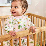 Kip & Co Sweet Daisy cotton baby bib with colorful daisy pattern on soft fabric, designed for gentle feeding and drool protection.