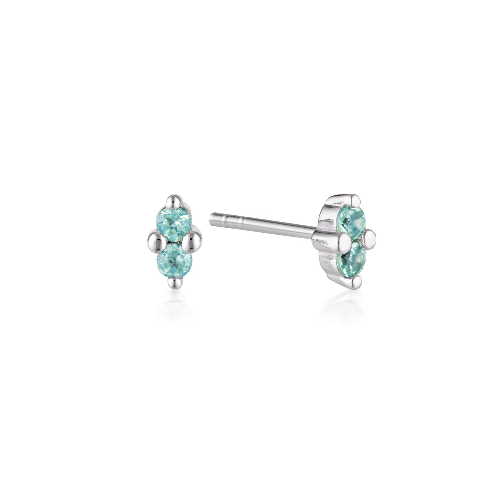 Linda Tahija December birthstone stud earrings featuring blue topaz set in silver, elegant jewelry for special occasions.