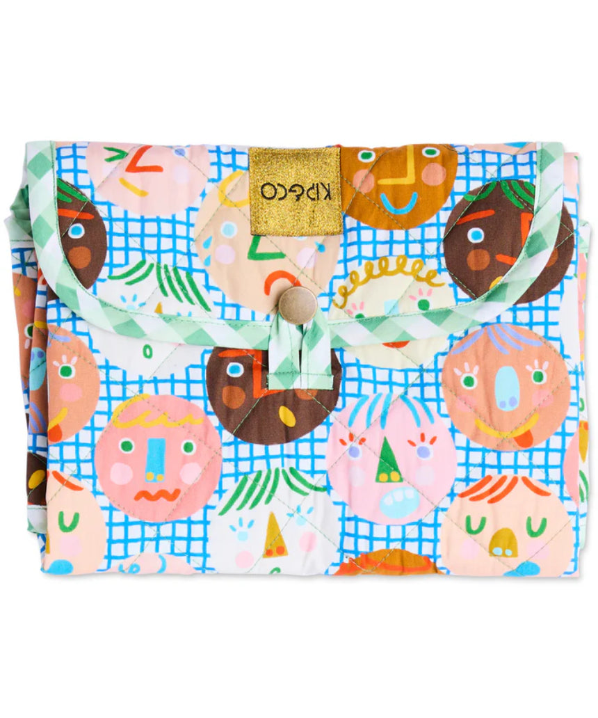 Kip & Co Cheer Up baby change mat with colorful, cheerful design and soft padded surface for comfortable diaper changes.