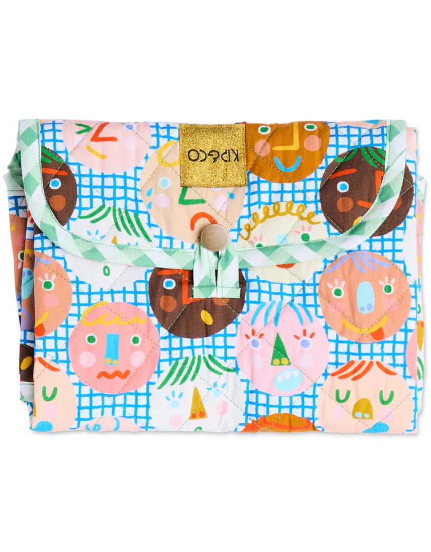 Kip & Co Cheer Up baby change mat with colorful, cheerful design and soft padded surface for comfortable diaper changes.