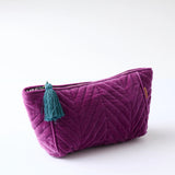 Kip & Co Wild Grape velvet toiletry bag with zipper closure, soft plush fabric, and compact design for travel accessories.