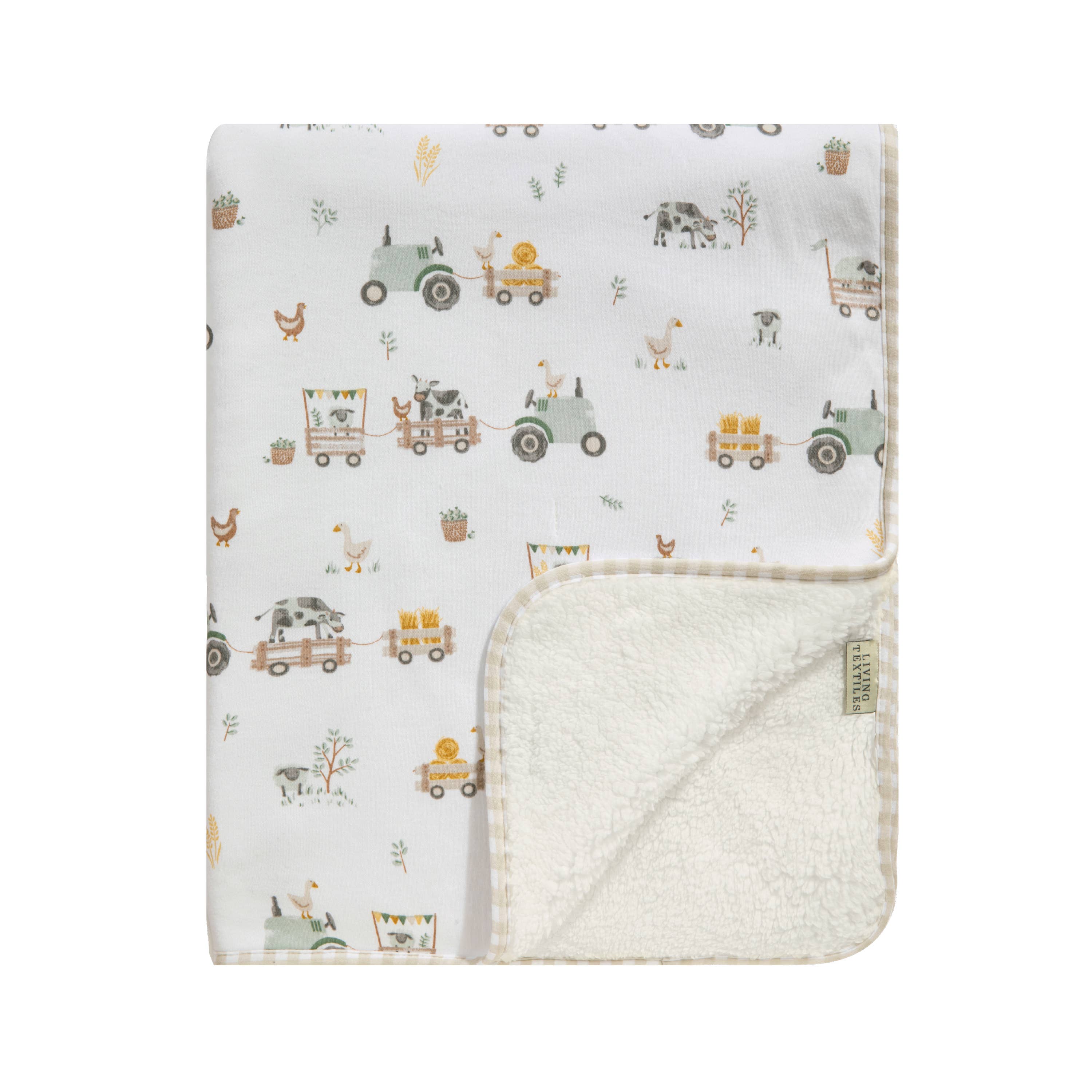 Living Textiles Jersey Sherpa Blanket featuring tractor ride print, soft jersey fabric with cozy sherpa backing, ideal for warm bedding.