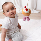 Living Textiles stroller toys featuring plush ice cream and cupcake designs, perfect for entertaining and soothing babies.