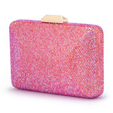 Olga Berg Edith iridescent pink clutch bag with a sleek, shiny finish and compact design for evening or special occasions.
