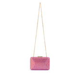 Olga Berg Edith iridescent pink clutch bag with a glossy finish and sleek design, perfect for evening occasions.