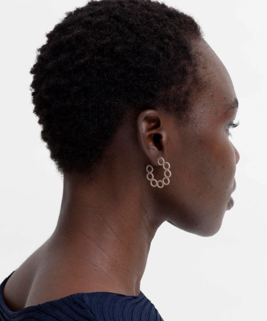 Ecru Tutra earring by Elk, showcasing a delicate accessory with intricate design and elegant craftsmanship.