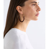 ELK The Label Aki hoop earring in tortoiseshell speckle with a round, lightweight design and gold-tone accent.