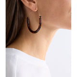 ELK The Label Aki Hoop Earring in tortoiseshell speckle, showcasing a stylish round earring with a tortoiseshell pattern.