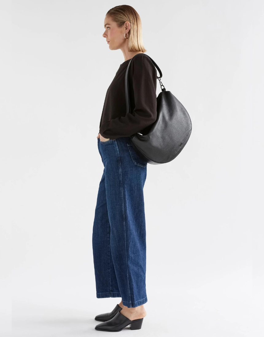 Black Elk Ilin Crossbody Bag with adjustable strap and sleek design, made for versatile everyday use.