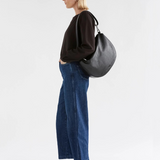 Black Elk Ilin Crossbody Bag with adjustable strap and sleek design, made for versatile everyday use.