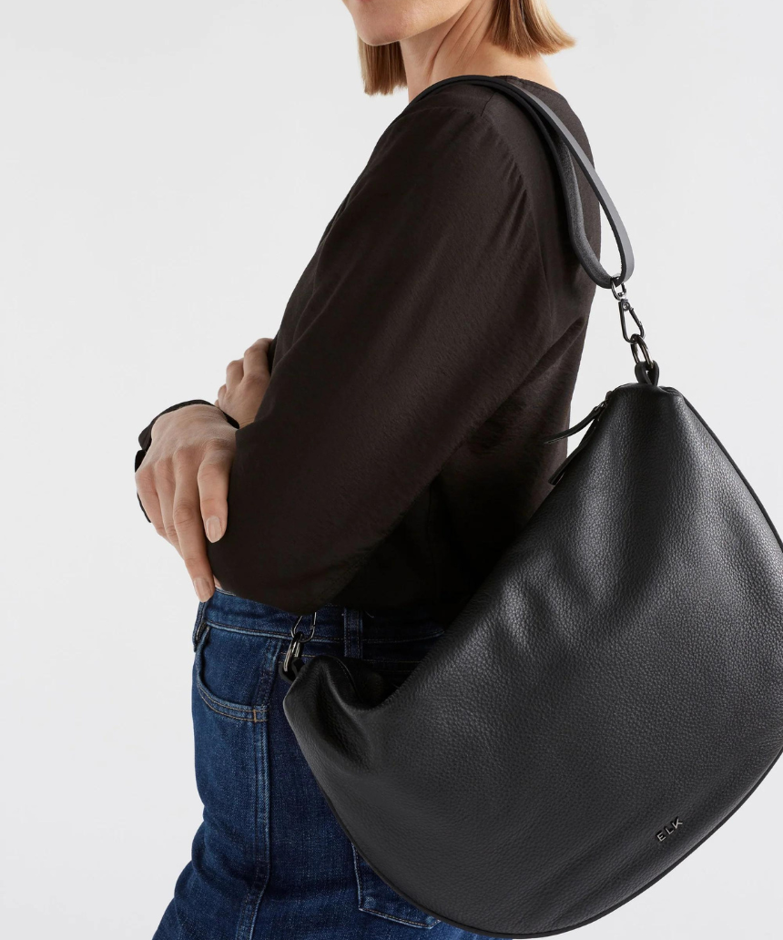 Black Elk Ilin Crossbody Bag showing adjustable strap, sleek design, and compact size for everyday carry.