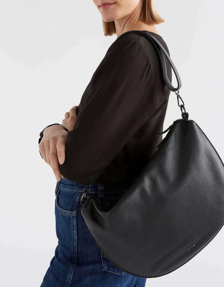 Black Elk Ilin Crossbody Bag showing adjustable strap, sleek design, and compact size for everyday carry.