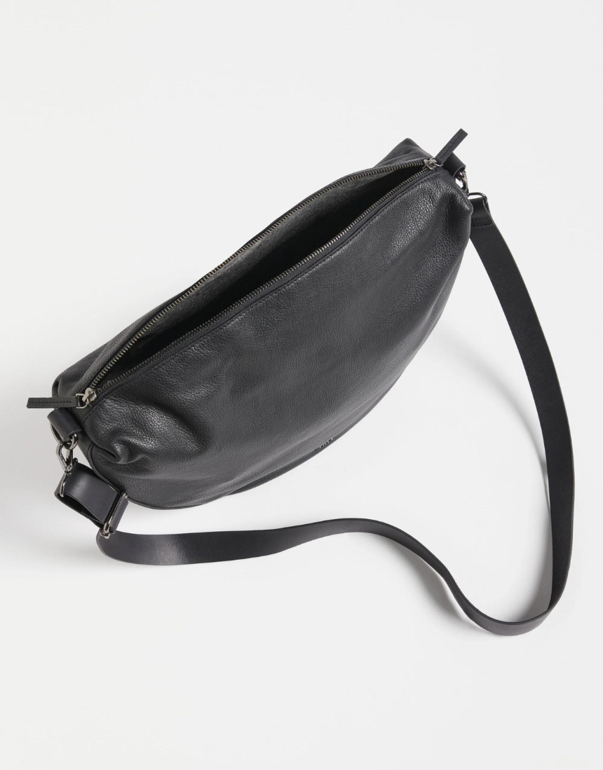 Black Elk Ilin Crossbody Bag shown with adjustable strap and sleek design, perfect for everyday use.