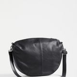 Black Elk Ilin crossbody bag with adjustable strap and sleek design, featuring a compact and stylish silhouette.
