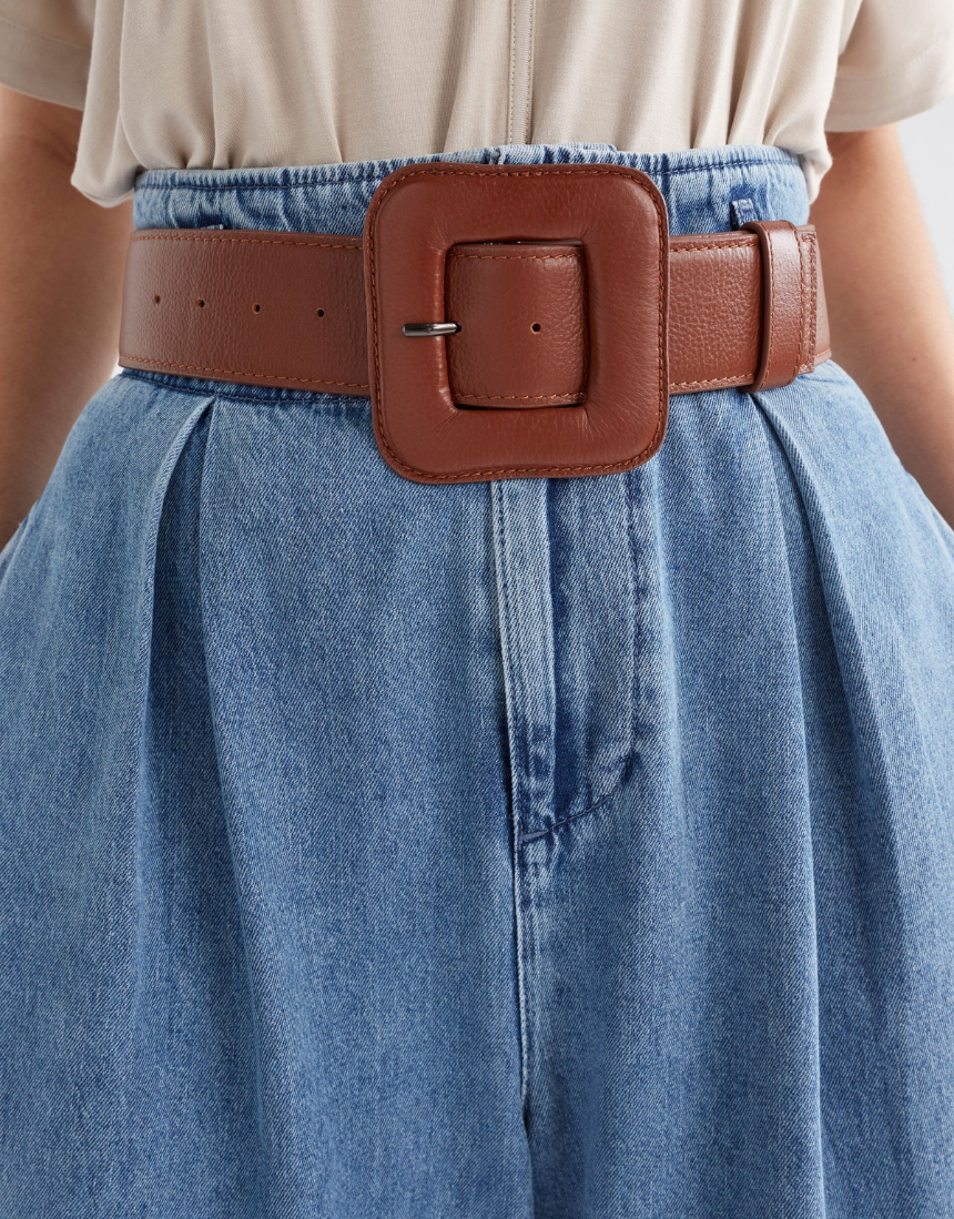 Black Elk Trin belt with adjustable strap and metal buckle, displayed on a neutral background.