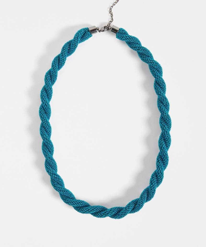Elk Kolle Necklace in teal with a sleek, minimalist design, featuring a smooth, curved pendant on a delicate chain.
