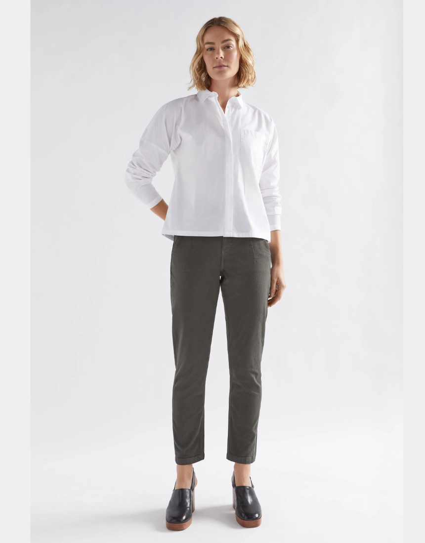 Olive green Elk Mysa Jean displayed on a hanger, showcasing the casual denim style and slim fit design.