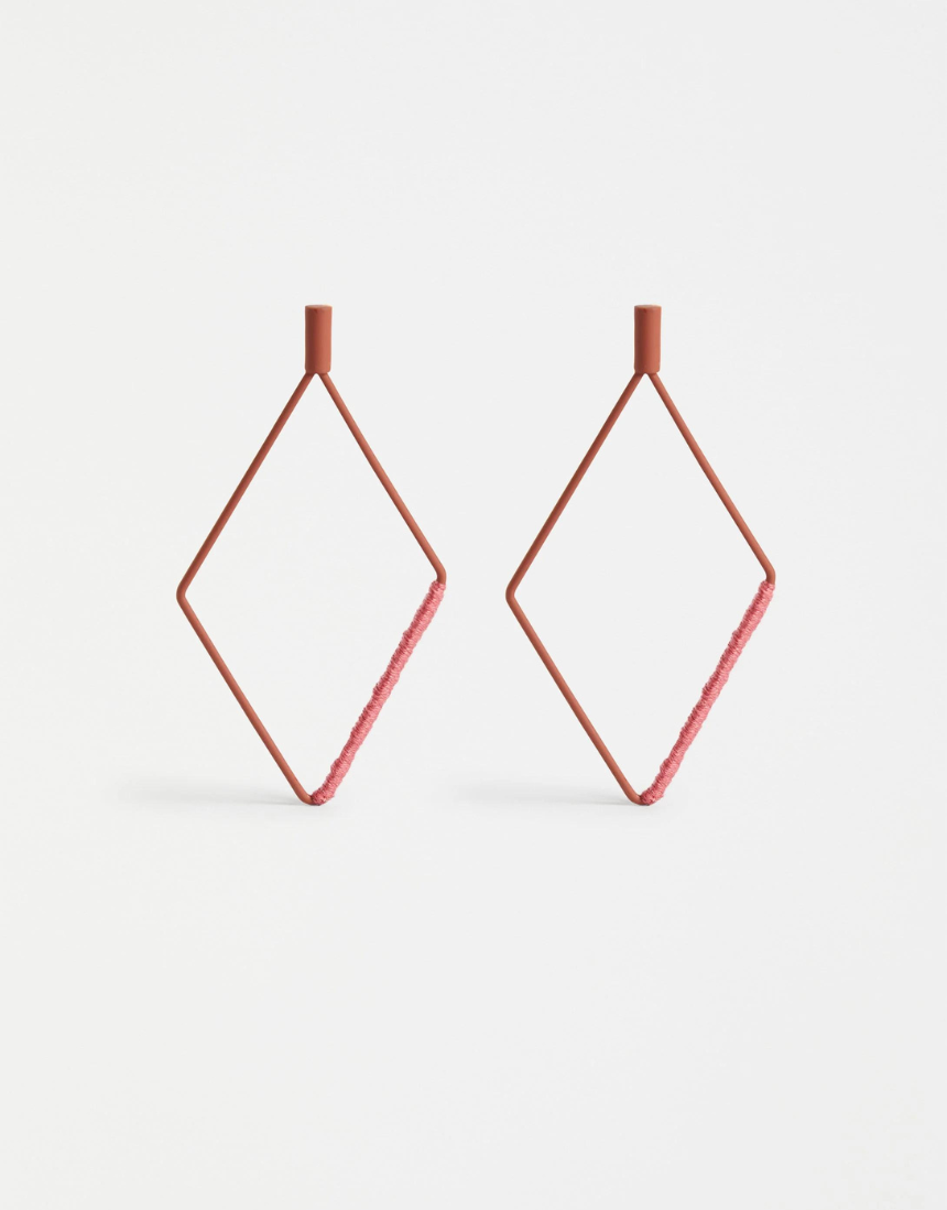 Elk Nett Drop Earrings in copper with delicate, layered design and hook-style clasps, hanging gracefully from the ears.