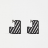 Black Elk Skaret Hoop Earring featuring a sleek, minimalist design with a smooth finish and circular shape.