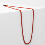 Elk Vell Long Necklace in vibrant flame orange with delicate chain and pendant, stylish jewelry accessory.