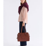 Pink Elk Erden Shirt from ELK The Label, stylish women's top with a relaxed fit and soft fabric, shown on a model.