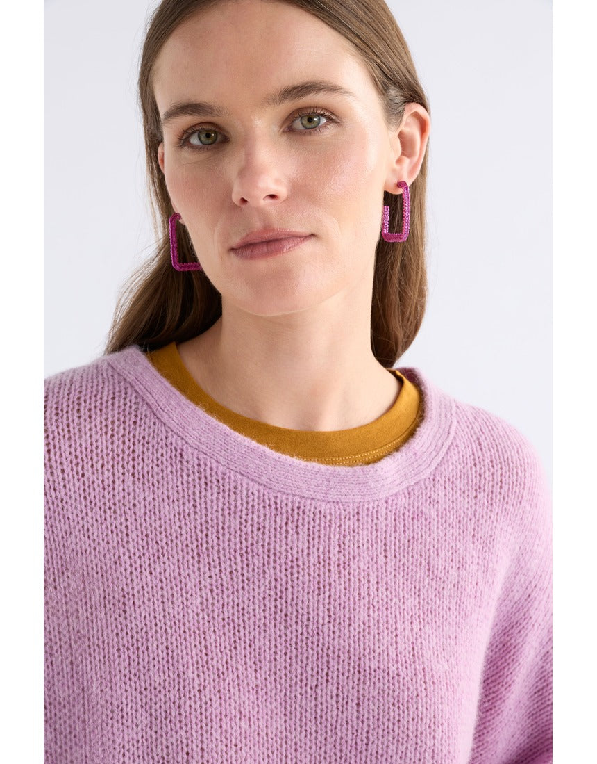 ELK The Label Hiva large hoop earrings in vibrant fuchsia, featuring bold circular design with a glossy finish.