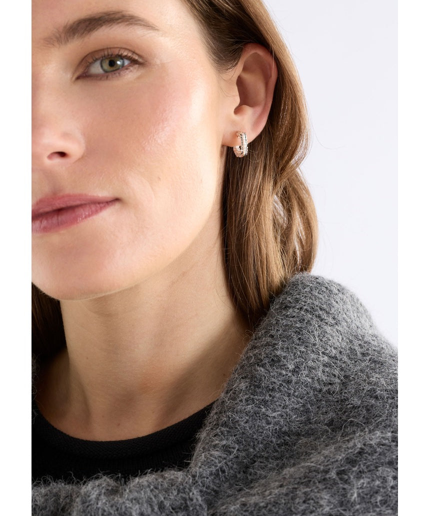 Silver Elk Hiva Mini Hoop Earring from ELK The Label, featuring a sleek, minimalist hoop design on a plain background.