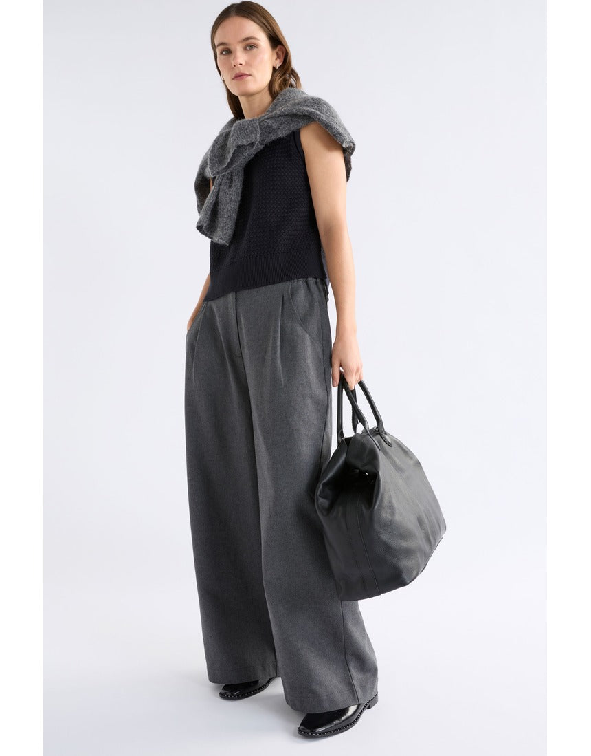 Black Elk Naya Knit Vest by ELK The Label, featuring a cozy knitwear design with a sleeveless silhouette and textured fabric.
