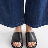 Black Elk Etin Slide shoes featuring a sleek design and comfortable slip-on style, perfect for casual wear.