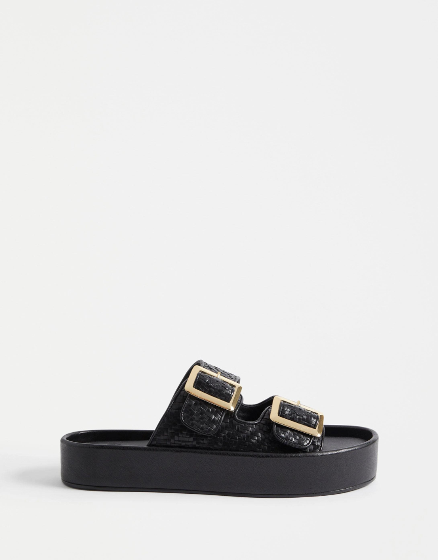 Black Elk Turi Platform shoes with chunky soles and sleek design, displayed on a plain background.