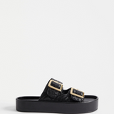 Black Elk Turi Platform shoes with chunky soles and sleek design, displayed on a plain background.