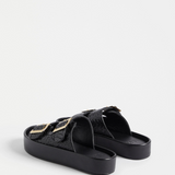 Black Elk Turi Platform shoes featuring a sleek design with sturdy soles and stylish ankle straps.