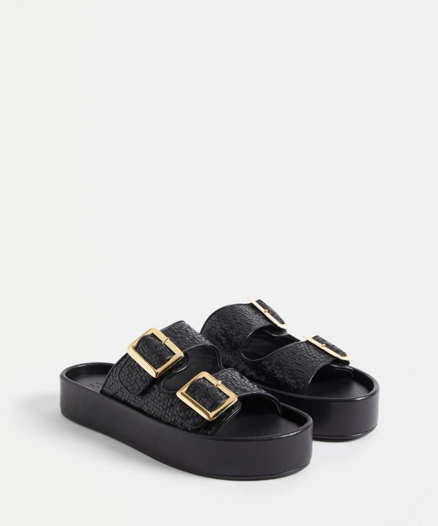 Black Elk Turi platform shoes featuring a sleek design and sturdy sole, perfect for casual and stylish everyday wear.