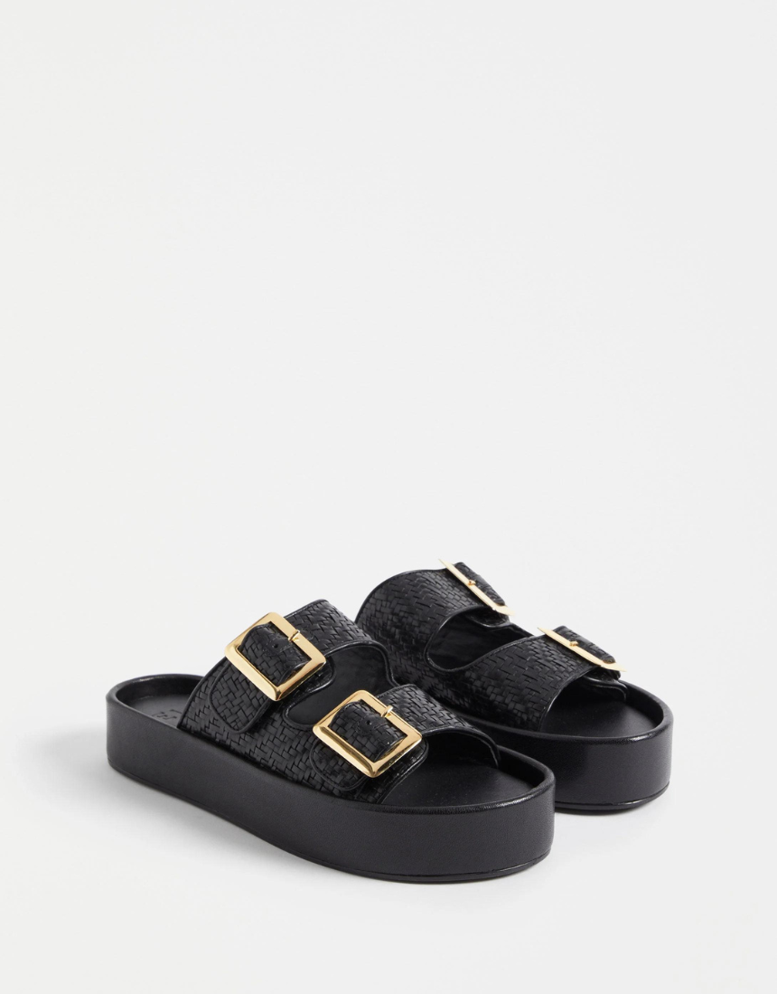 Black Elk Turi platform shoes featuring a sleek design and sturdy sole, perfect for casual and stylish everyday wear.