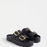 Black Elk Turi platform shoes featuring a sleek design and sturdy sole, perfect for casual and stylish everyday wear.
