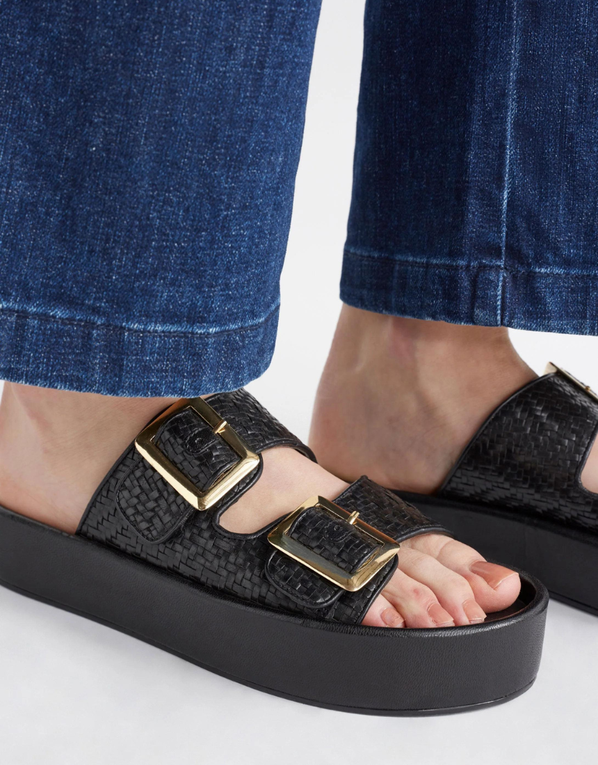 Black Elk Turi Platform Shoes with chunky soles and sleek design, showcasing modern footwear style.