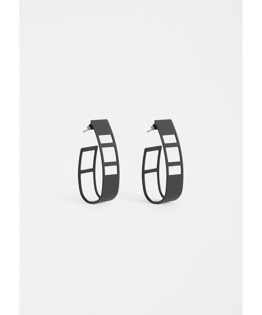 Black Elk Skeni Earring by ELK The Label featuring a sleek, modern earring design with minimalist style.