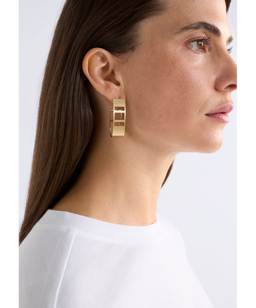 Gold Elk Skeni earrings by ELK The Label featuring delicate hoop design with subtle textured finish.