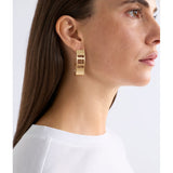 Gold Elk Skeni earrings by ELK The Label featuring delicate hoop design with subtle textured finish.