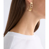 Gold Elk Skeni earrings by ELK The Label, featuring minimalist design and sleek gold finish for elegant everyday wear.